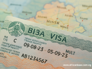 Study in Belarus 2025: Visa, Costs, Universities & Application Guide A Belarus visa with Cyrillic and Latin text is placed on a blurred map, showing the city Minsk. Highlighting Study in Belarus 2025, the visa displays dates, numbers, and an emblem at the top left.