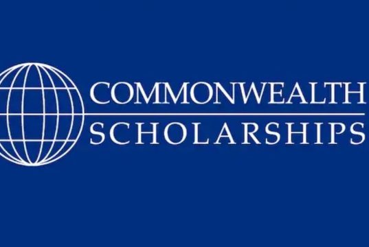 Commonwealth Scholarships for Nigerian Students 2026/2027: Eligibility, Benefits & How to Apply for the Next Cycle A blue background with a white outlined globe on the left and the text “Commonwealth UK Scholarships” in uppercase white letters to the right.