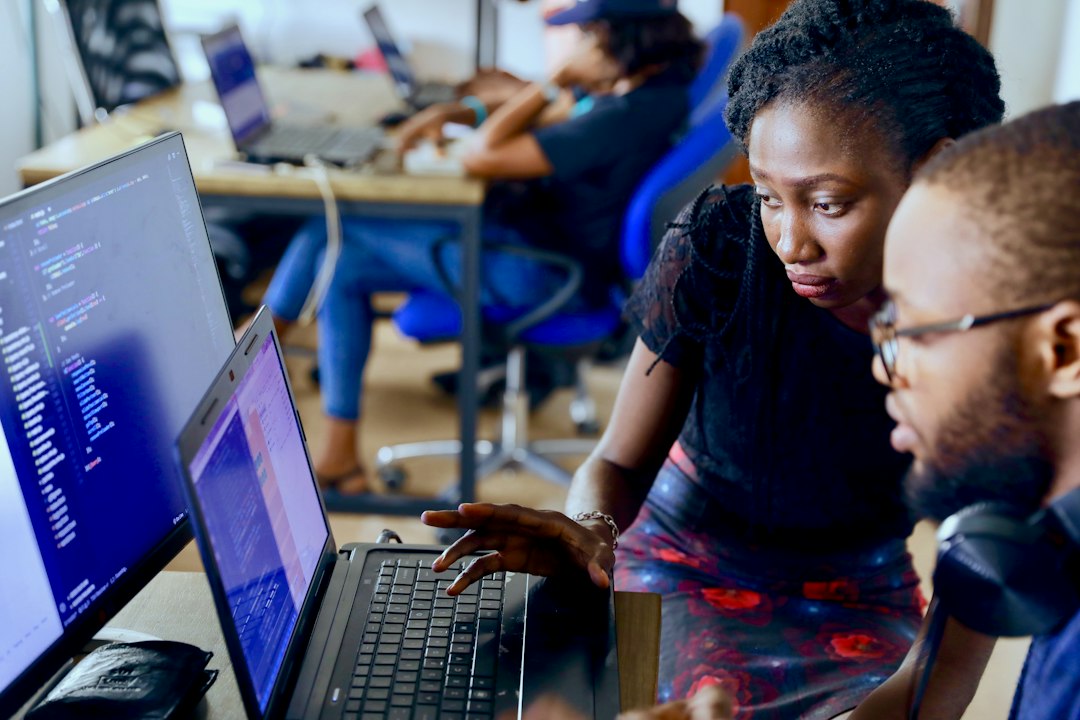 Young African professionals collaborating on digital skills training